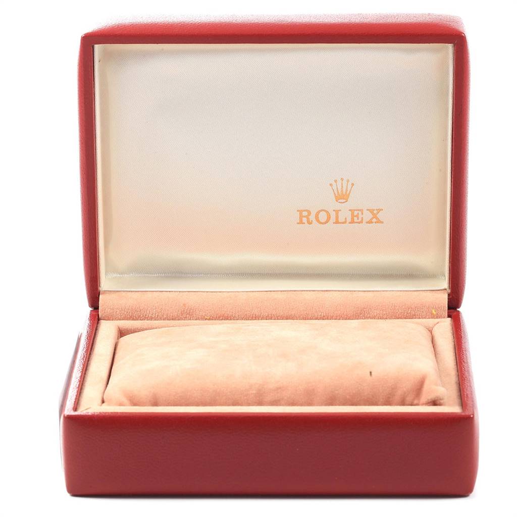 This image shows an open red watch box with a beige interior and the Rolex logo, but it does not display the Oyster Perpetual watch.