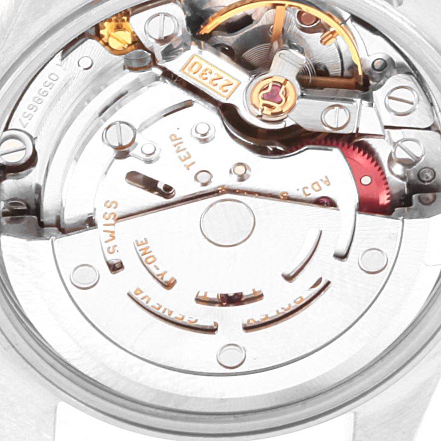 This image shows a close-up view of the movement of a Rolex Oyster Perpetual 76094 Women's Stainless Steel Pink Dial 76094 Women's Stainless Steel Pink Dial watch.