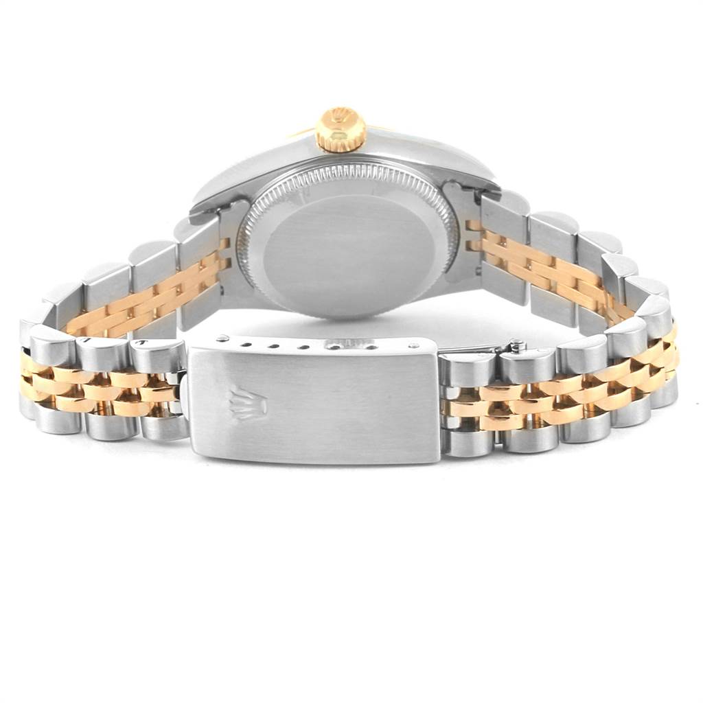 The image shows the back of a Rolex Oyster Perpetual 67193 Women
s Steel and Gold (two tone) Black Dial 67193 Women
s Steel and Gold (two tone) Black Dial watch, highlighting its bi-metal bracelet and clasp.