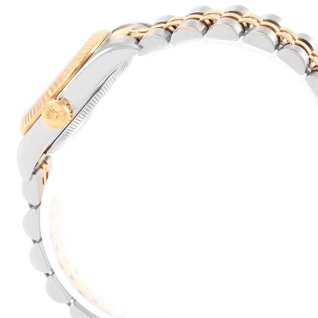 The image shows a side view of a Rolex Oyster Perpetual 67193 Women
s Steel and Gold (two tone) Black Dial 67193 Women
s Steel and Gold (two tone) Black Dial watch, focusing on the crown and bracelet links.