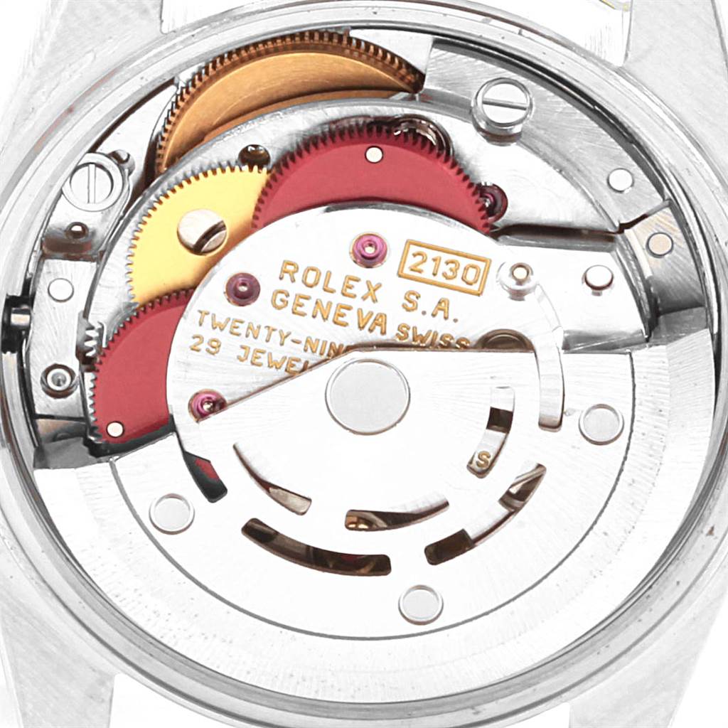 This image shows a close-up of the movement and internal mechanics of a Rolex Oyster Perpetual 67193 Women
s Steel and Gold (two tone) Black Dial 67193 Women
s Steel and Gold (two tone) Black Dial watch.