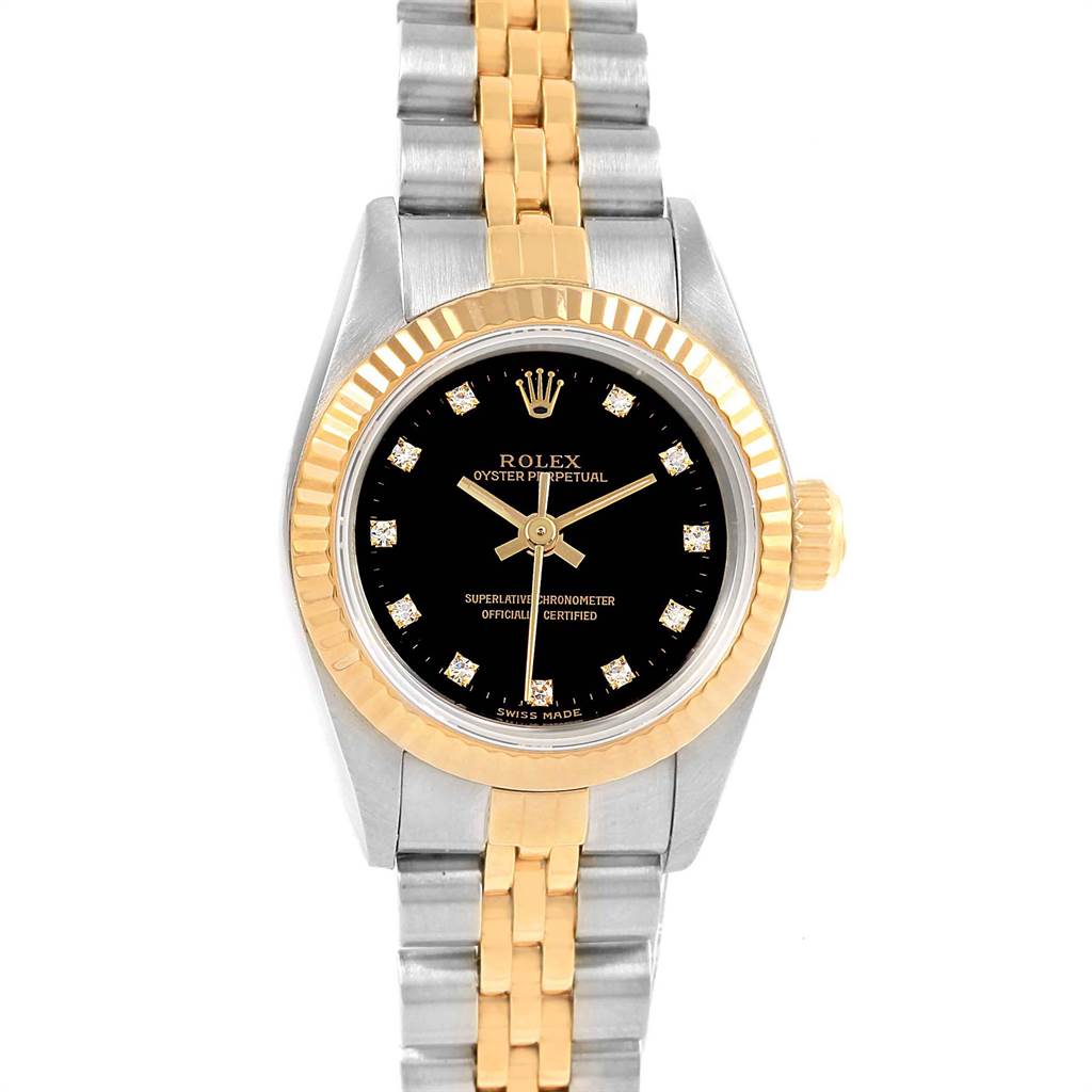 This Rolex Oyster Perpetual 67193 Women
s Steel and Gold (two tone) Black Dial 67193 Women
s Steel and Gold (two tone) Black Dial watch is shown from the front, featuring a black dial, gold bezel, and two-tone metal bracelet.