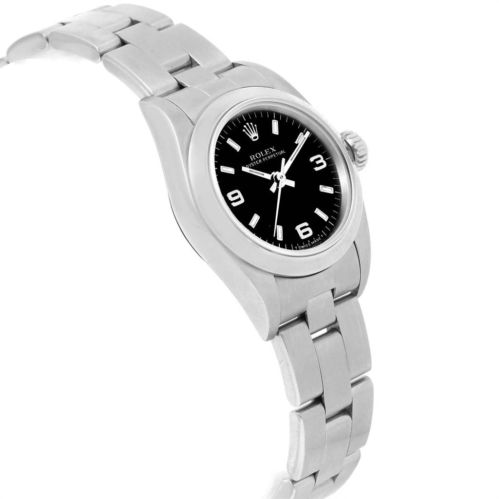 This image shows a side angle of the Rolex Oyster Perpetual 67180 Women
s Stainless Steel Black Dial 67180 Women
s Stainless Steel Black Dial watch, displaying the face, crown, and part of the bracelet.