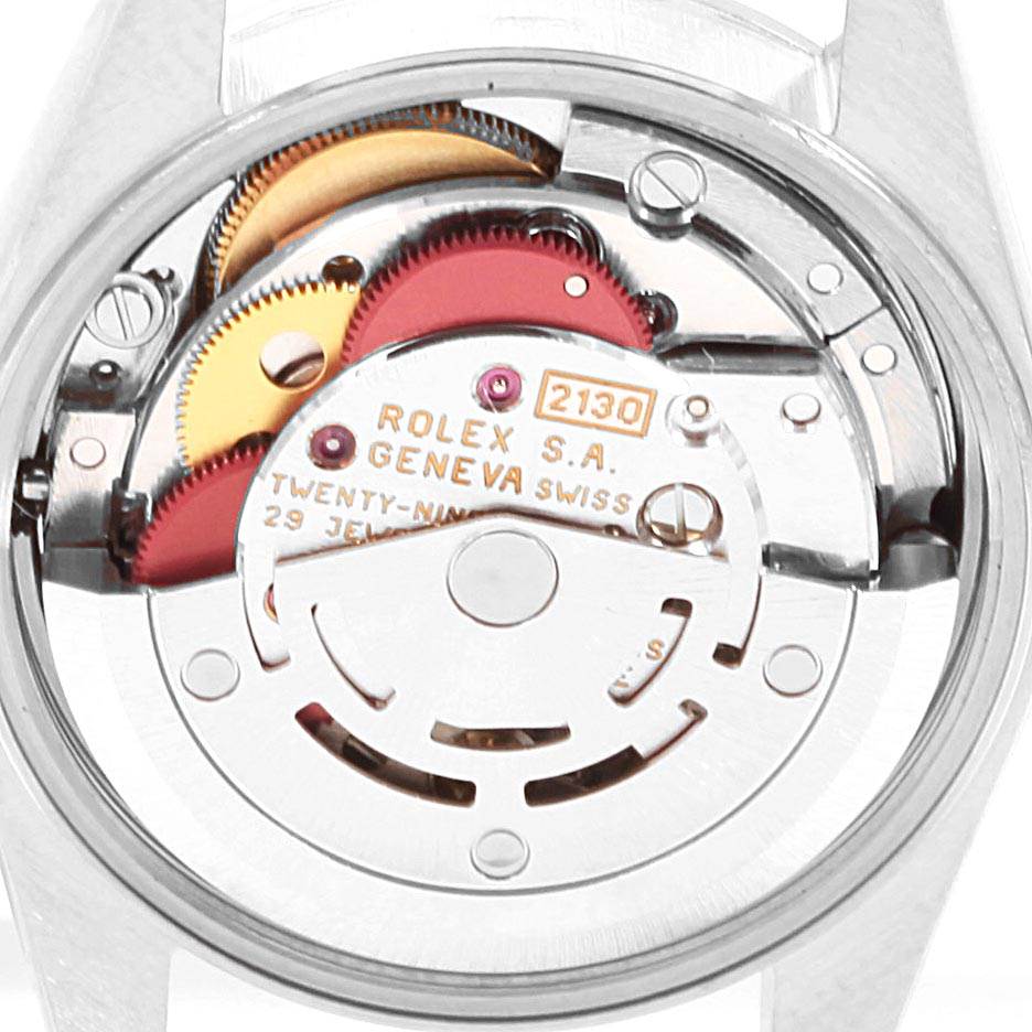 This is the back view of a Rolex Oyster Perpetual 67180 Women
s Stainless Steel Black Dial 67180 Women
s Stainless Steel Black Dial watch showing its inner mechanical movement components.