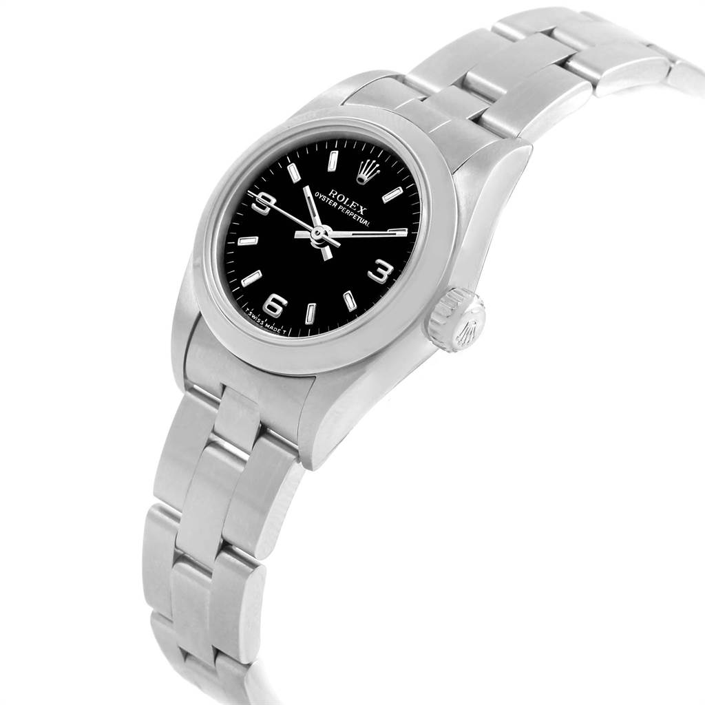 This Rolex Oyster Perpetual 67180 Women
s Stainless Steel Black Dial 67180 Women
s Stainless Steel Black Dial watch is shown at an angle displaying the face, bezel, crown, and part of the bracelet.