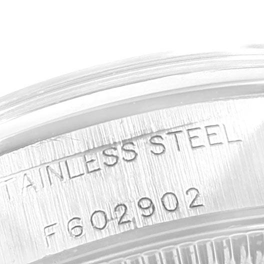 The image shows a close-up of the stainless steel case back with the serial number of a Rolex Oyster Perpetual 76080 Women's Stainless Steel Pink Dial 76080 Women's Stainless Steel Pink Dial watch.