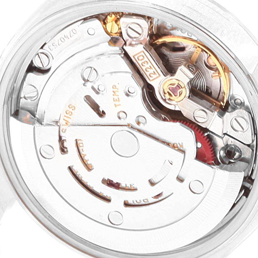 This image shows a close-up view of the movement mechanism inside a Rolex Oyster Perpetual 76080 Women's Stainless Steel Pink Dial 76080 Women's Stainless Steel Pink Dial watch.