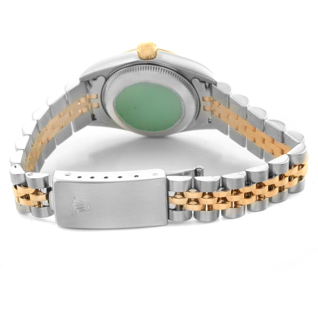 The image shows the back case and bracelet of a Rolex Oyster Perpetual 76193 Women's Steel and Gold (two tone) Champagne Dial 76193 Women's Steel and Gold (two tone) Champagne Dial watch, highlighting the clasp and bi-color links.