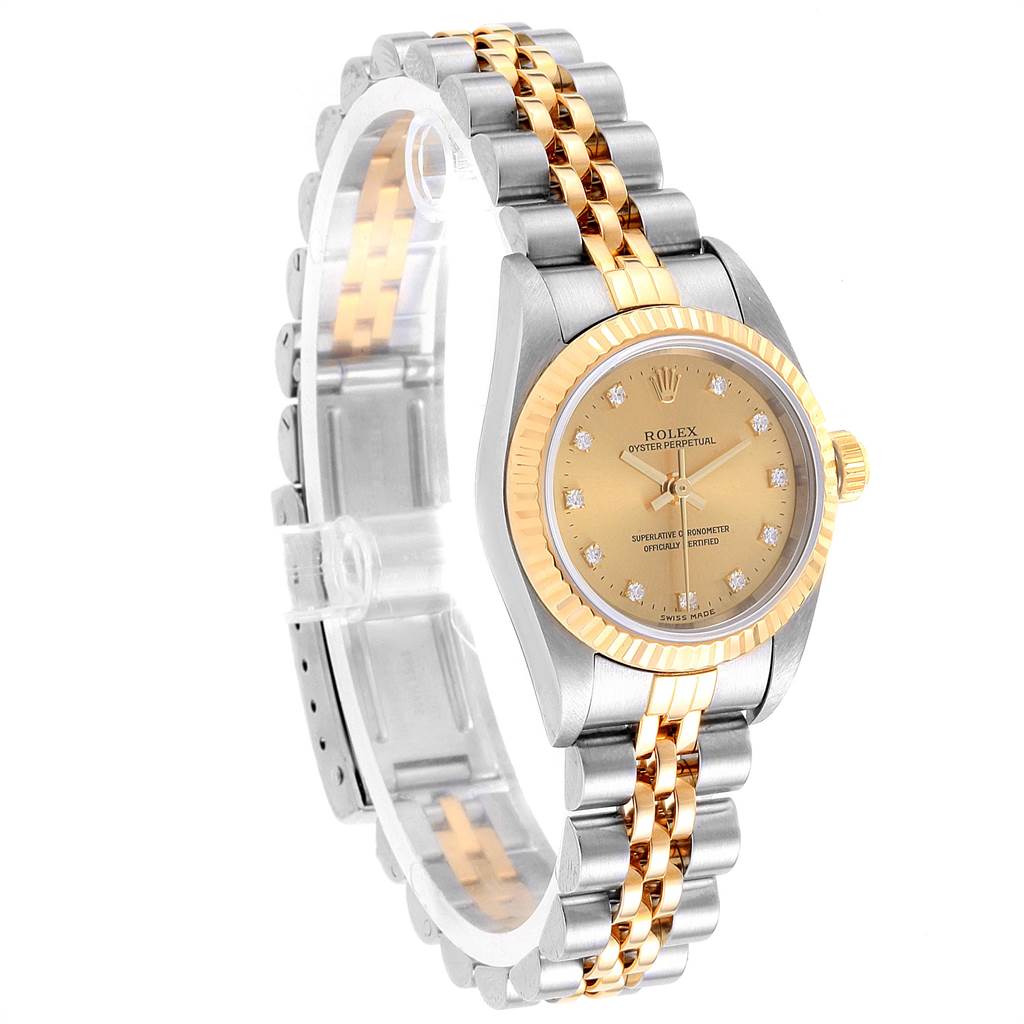 The image shows a Rolex Oyster Perpetual 76193 Women's Steel and Gold (two tone) Champagne Dial 76193 Women's Steel and Gold (two tone) Champagne Dial watch at an angled side view, highlighting the two-tone bracelet and gold bezel.
