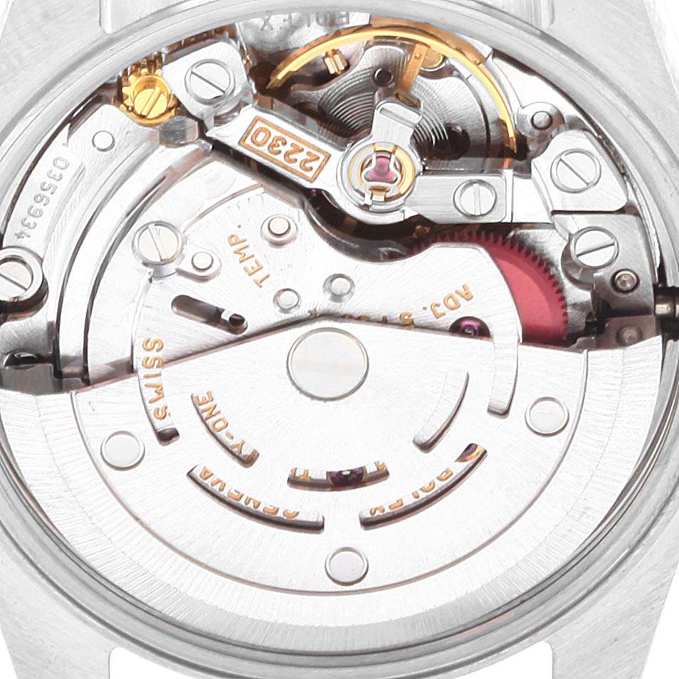 The image shows a close-up of the movement inside a Rolex Oyster Perpetual 76193 Women's Steel and Gold (two tone) Champagne Dial 76193 Women's Steel and Gold (two tone) Champagne Dial watch, focusing on its intricate mechanical components.