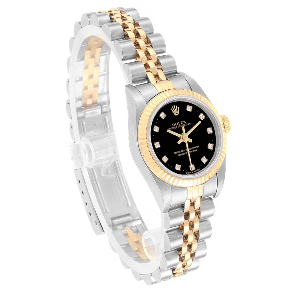 This image shows a Rolex Oyster Perpetual 76193 Women
s Steel and Gold (two tone) Black Dial 76193 Women
s Steel and Gold (two tone) Black Dial watch angled to display the face, bezel, and two-tone bracelet.