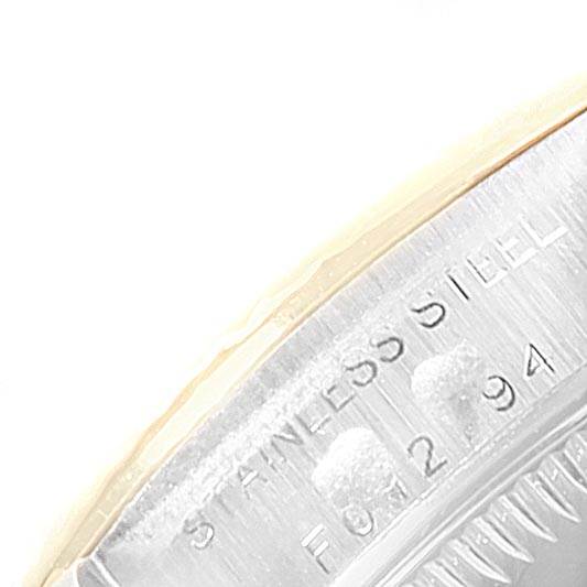 This close-up shows part of the back casing of the Rolex Oyster Perpetual 76193 Women
s Steel and Gold (two tone) Black Dial 76193 Women
s Steel and Gold (two tone) Black Dial, highlighting its "STAINLESS STEEL" marking.