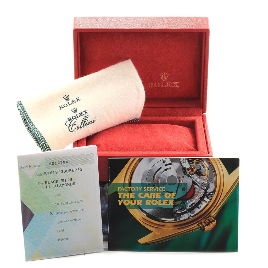 The image shows a Rolex Oyster Perpetual 76193 Women
s Steel and Gold (two tone) Black Dial 76193 Women
s Steel and Gold (two tone) Black Dial watch box, a Rolex Cellini cloth, care booklet, and a certificate.