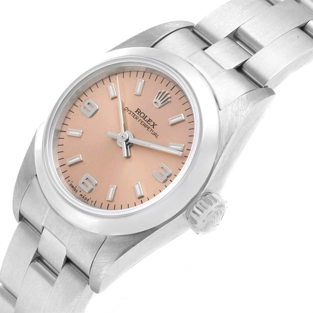 This image shows a close-up view of the Rolex Oyster Perpetual 67180 Women's Stainless Steel Pink Dial 67180 Women's Stainless Steel Pink Dial watch from an angled perspective, displaying the dial, bezel, crown, and part of the bracelet.