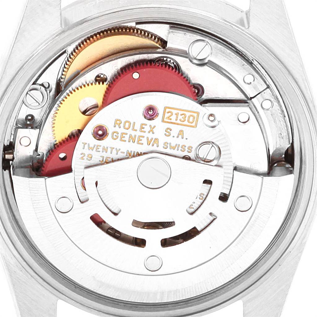 This image shows a close-up view of the movement assembly of a Rolex Oyster Perpetual 67180 Women's Stainless Steel Pink Dial 67180 Women's Stainless Steel Pink Dial watch.