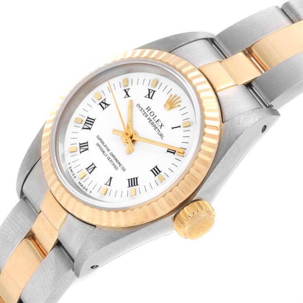 This image shows a close-up view of a Rolex Oyster Perpetual 67193 Women's Steel and Gold (two tone) White Dial 67193 Women's Steel and Gold (two tone) White Dial watch, highlighting the dial, bezel, and part of the bracelet.
