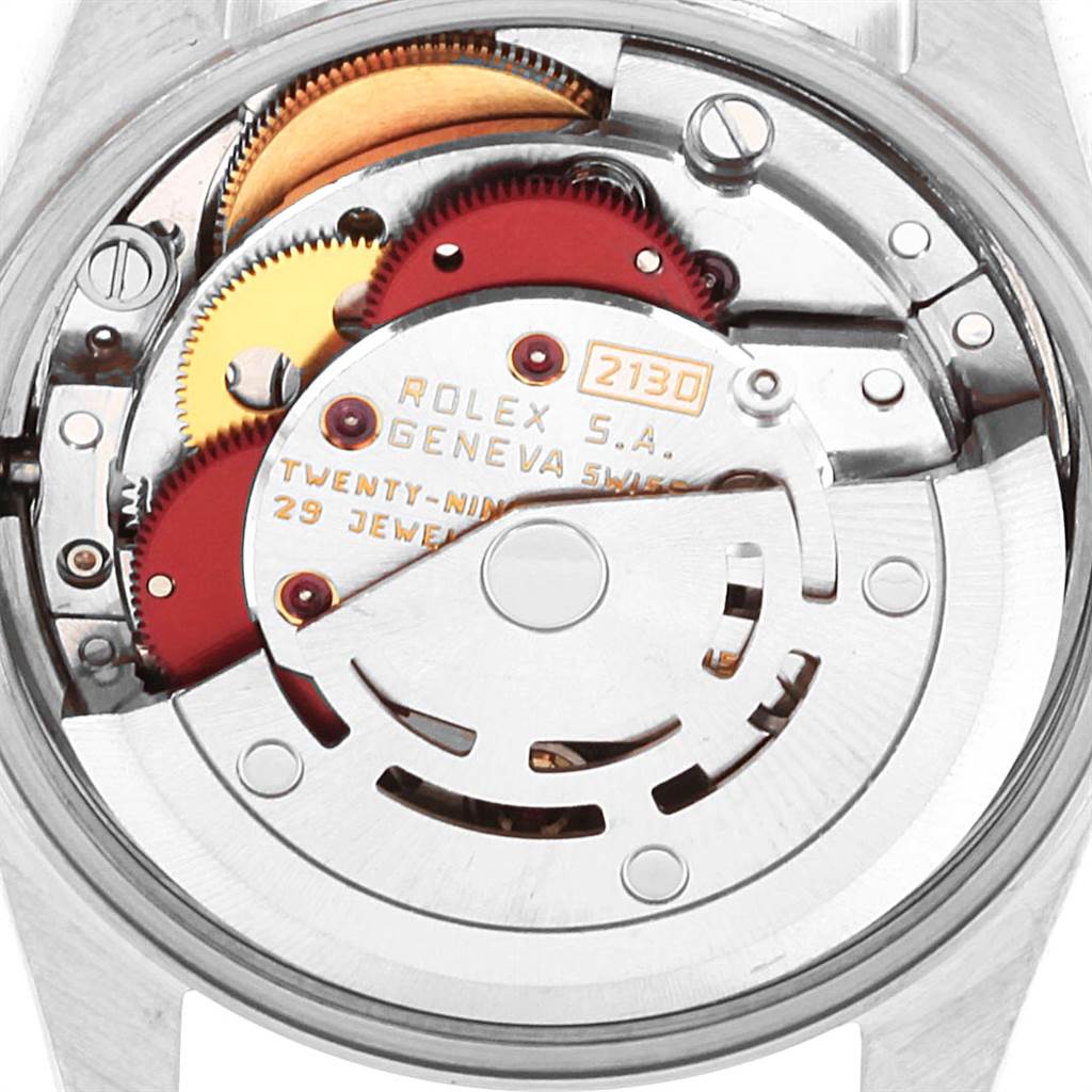 The image shows a close-up of the internal mechanism of a Rolex Oyster Perpetual 67193 Women's Steel and Gold (two tone) White Dial 67193 Women's Steel and Gold (two tone) White Dial watch from a top-down angle.