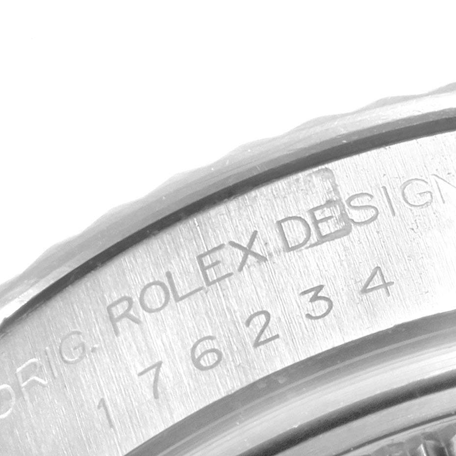 This image shows a close-up of the watch casing for a Rolex Oyster Perpetual 176234 Women
s Stainless Steel Black Dial 176234 Women
s Stainless Steel Black Dial model, highlighting its engraved design and serial numbers.