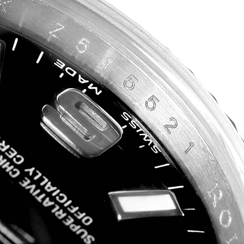 The image shows a close-up angled view of the bezel and dial of a Rolex Oyster Perpetual 176234 Women
s Stainless Steel Black Dial 176234 Women
s Stainless Steel Black Dial watch.