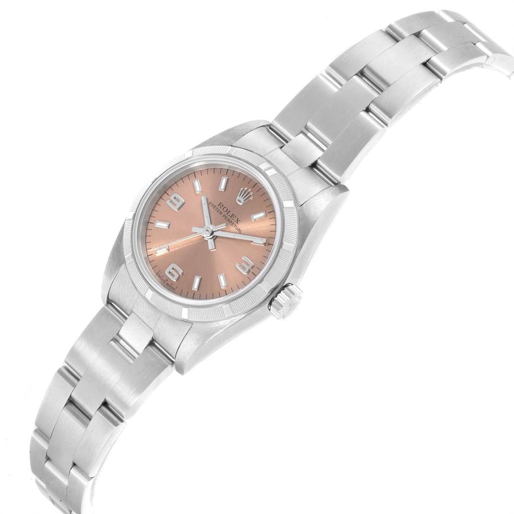 The image shows a Rolex Oyster Perpetual 76030 Women's Stainless Steel Pink Dial 76030 Women's Stainless Steel Pink Dial watch at a slight angle, displaying its dial, bezel, bracelet, and crown.