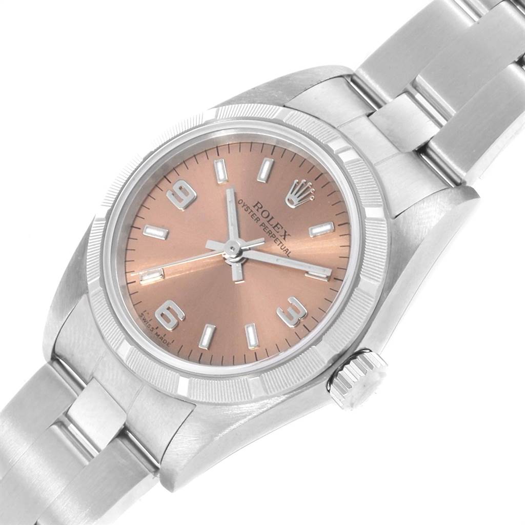 The image shows a close-up of a Rolex Oyster Perpetual 76030 Women's Stainless Steel Pink Dial 76030 Women's Stainless Steel Pink Dial watch displaying its face, crown, and part of the bracelet.