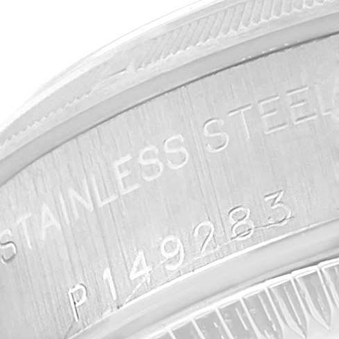 This image shows a close-up of the engraved serial number and "STAINLESS STEEL" text on the side of a Rolex Oyster Perpetual 76030 Women's Stainless Steel Pink Dial 76030 Women's Stainless Steel Pink Dial watch.