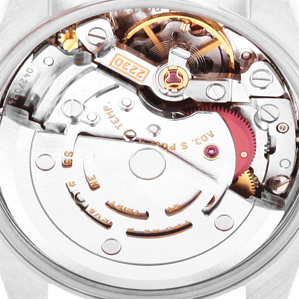 This image shows the movement and internal components of a Rolex Oyster Perpetual 76030 Women's Stainless Steel Pink Dial 76030 Women's Stainless Steel Pink Dial watch from a close-up angle.