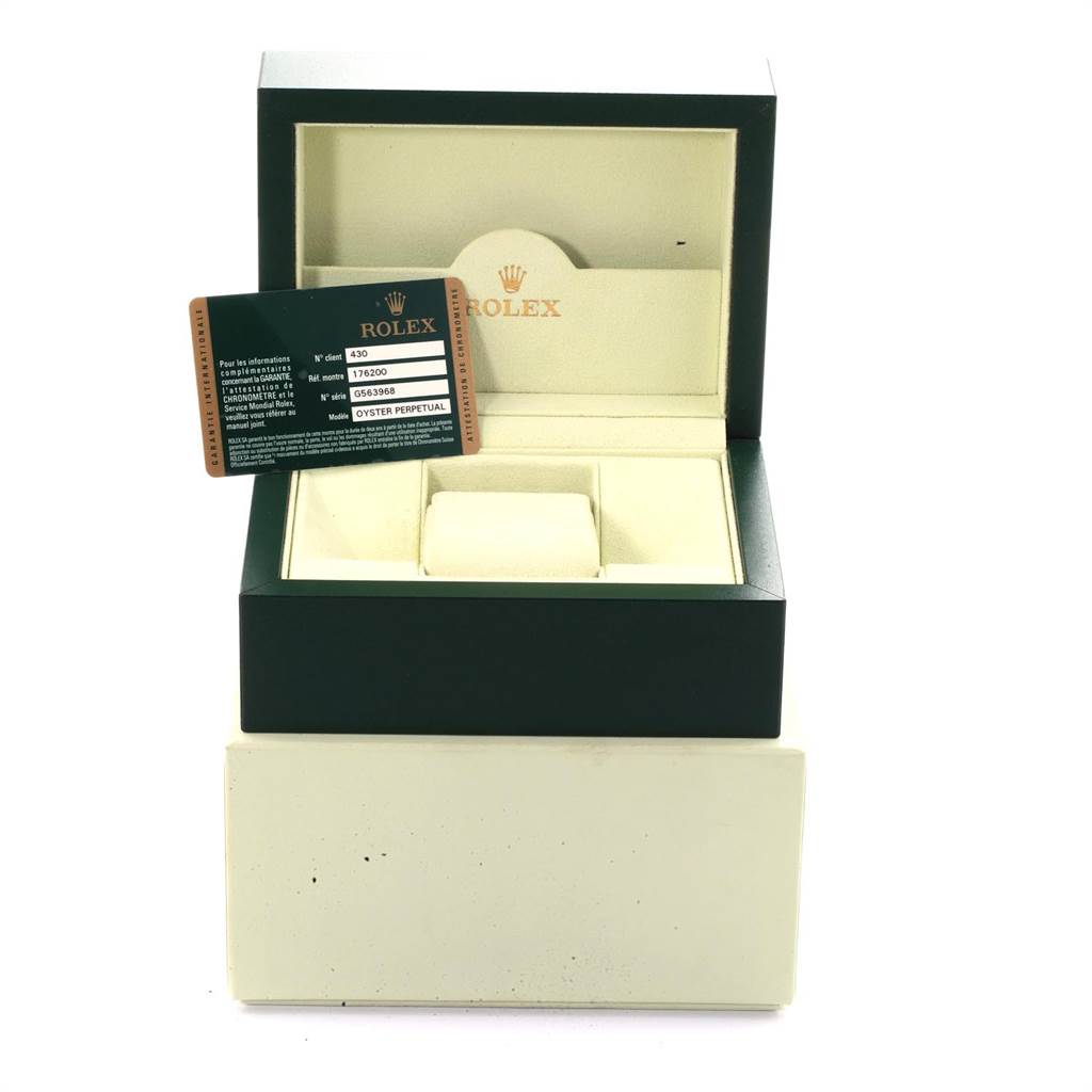 This image shows the packaging and authentication card for a Rolex Oyster Perpetual 176200 Women's Stainless Steel Pink Dial 176200 Women's Stainless Steel Pink Dial watch with a top-down angle.