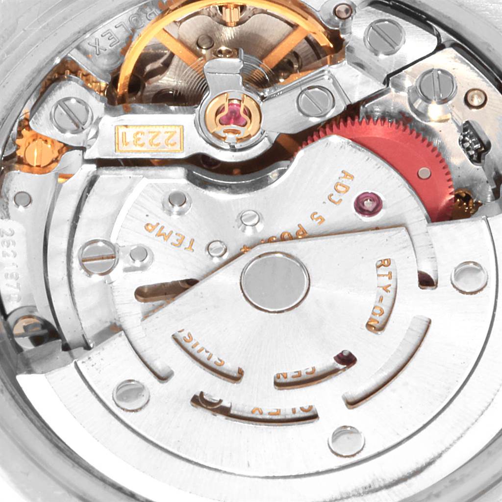 This image shows an angled close-up view of the intricate inner mechanical workings of a Rolex Oyster Perpetual 176200 Women's Stainless Steel Pink Dial 176200 Women's Stainless Steel Pink Dial watch.