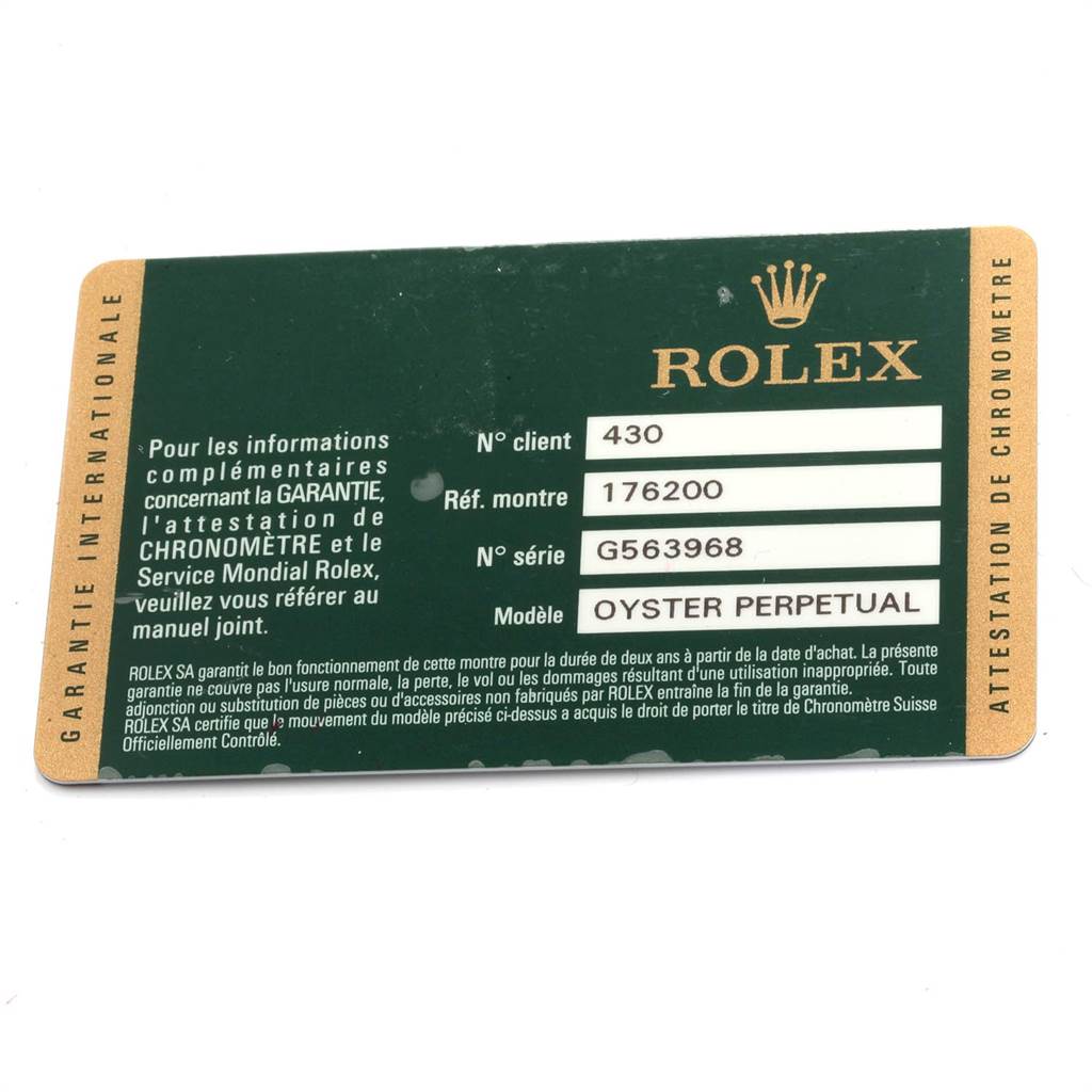 This image shows the warranty card for a Rolex Oyster Perpetual 176200 Women's Stainless Steel Pink Dial 176200 Women's Stainless Steel Pink Dial watch, listing client number, reference number, and serial number.