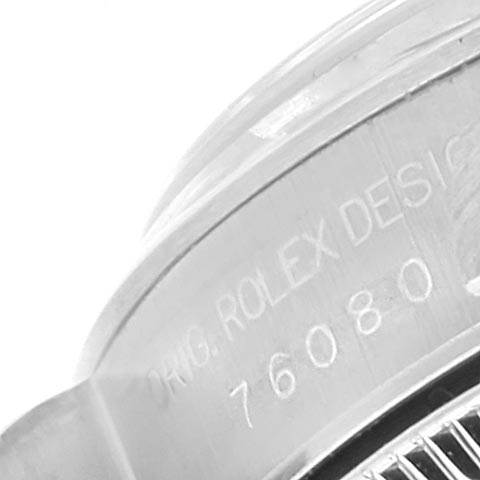 The image shows a close-up angle of the case side and engraving details of the Rolex Oyster Perpetual 76080 Women's Stainless Steel Pink Dial 76080 Women's Stainless Steel Pink Dial model.