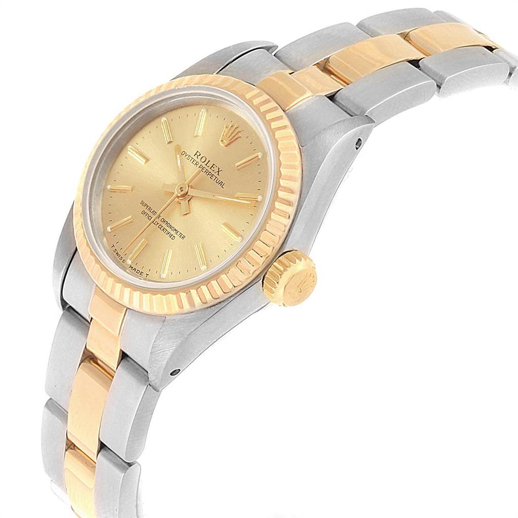 The image shows a Rolex Oyster Perpetual 67193 Women's Steel and Gold (two tone) Champagne Dial 67193 Women's Steel and Gold (two tone) Champagne Dial watch at an angle, displaying the face, bezel, crown, and bracelet.