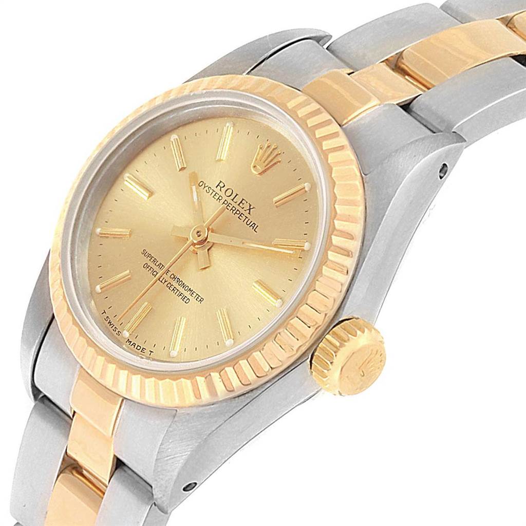 The image shows a Rolex Oyster Perpetual 67193 Women's Steel and Gold (two tone) Champagne Dial 67193 Women's Steel and Gold (two tone) Champagne Dial watch from an angled side view, highlighting the face, crown, and part of the bracelet.