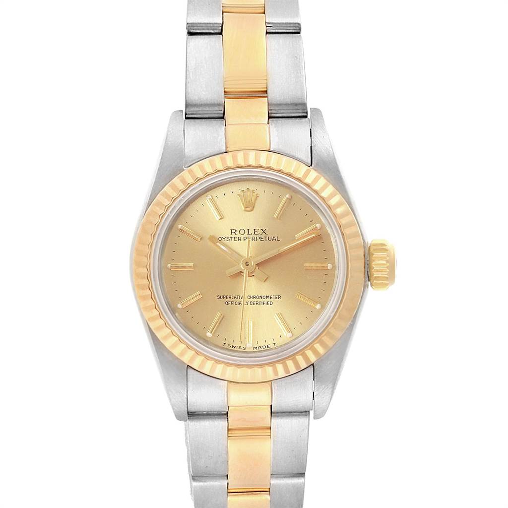 The image shows a front view of the Rolex Oyster Perpetual 67193 Women's Steel and Gold (two tone) Champagne Dial 67193 Women's Steel and Gold (two tone) Champagne Dial watch, highlighting its gold and silver bracelet and gold watch face.