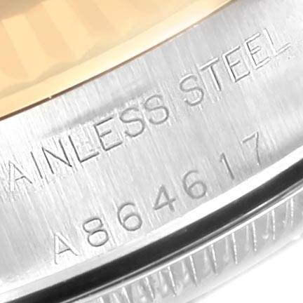 This close-up image shows a part of the stainless steel back casing of a Rolex Oyster Perpetual 76193 Women's Steel and Gold (two tone) Champagne Dial 76193 Women's Steel and Gold (two tone) Champagne Dial watch, including the model number.