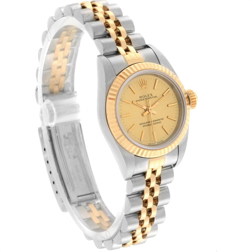 The Rolex Oyster Perpetual 76193 Women's Steel and Gold (two tone) Champagne Dial 76193 Women's Steel and Gold (two tone) Champagne Dial watch is shown at a three-quarter angle, highlighting the face, bezel, and bracelet.