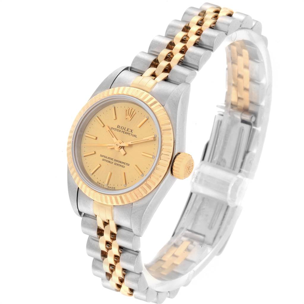 The Rolex Oyster Perpetual 76193 Women's Steel and Gold (two tone) Champagne Dial 76193 Women's Steel and Gold (two tone) Champagne Dial watch is shown at a slight angle highlighting the face, bezel, crown, and two-tone bracelet.