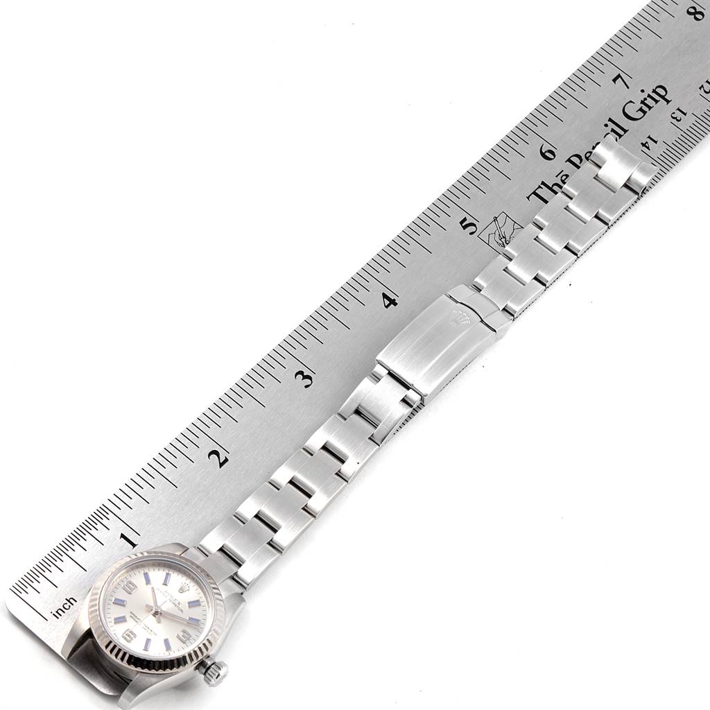 The image shows a Rolex Oyster Perpetual 176234 Women's Stainless Steel Silver Dial 176234 Women's Stainless Steel Silver Dial watch laid next to a ruler, capturing both the dial and bracelet.