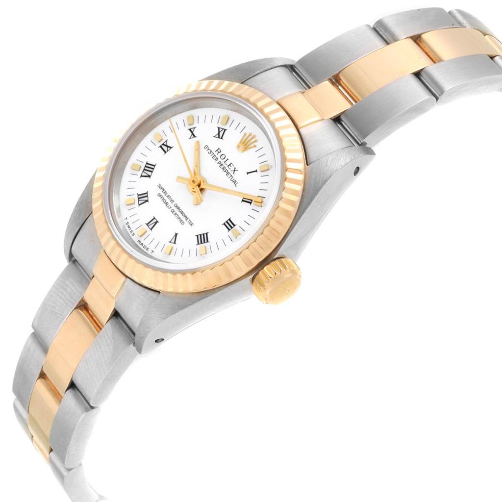 The Rolex Oyster Perpetual 67193 Women's Steel and Gold (two tone) White Dial 67193 Women's Steel and Gold (two tone) White Dial watch is shown at an angled view, displaying its two-tone bezel, dial, crown, and bracelet.