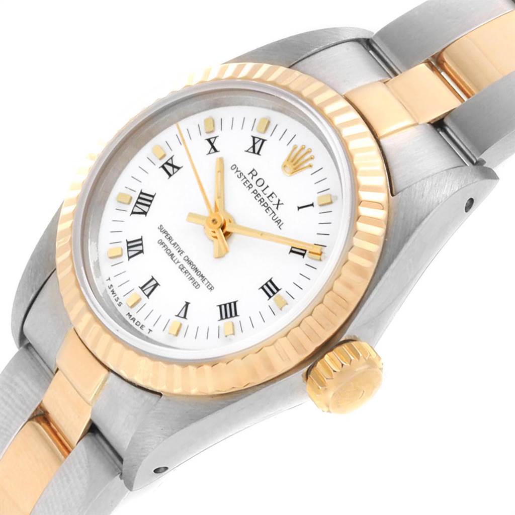 This image shows a close-up of the Rolex Oyster Perpetual 67193 Women's Steel and Gold (two tone) White Dial 67193 Women's Steel and Gold (two tone) White Dial watch's dial, bezel, crown, and part of the bracelet.
