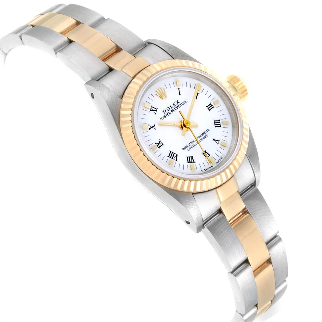 The Rolex Oyster Perpetual 67193 Women's Steel and Gold (two tone) White Dial 67193 Women's Steel and Gold (two tone) White Dial watch is shown at an angle detailing the face, fluted bezel, and two-tone bracelet.