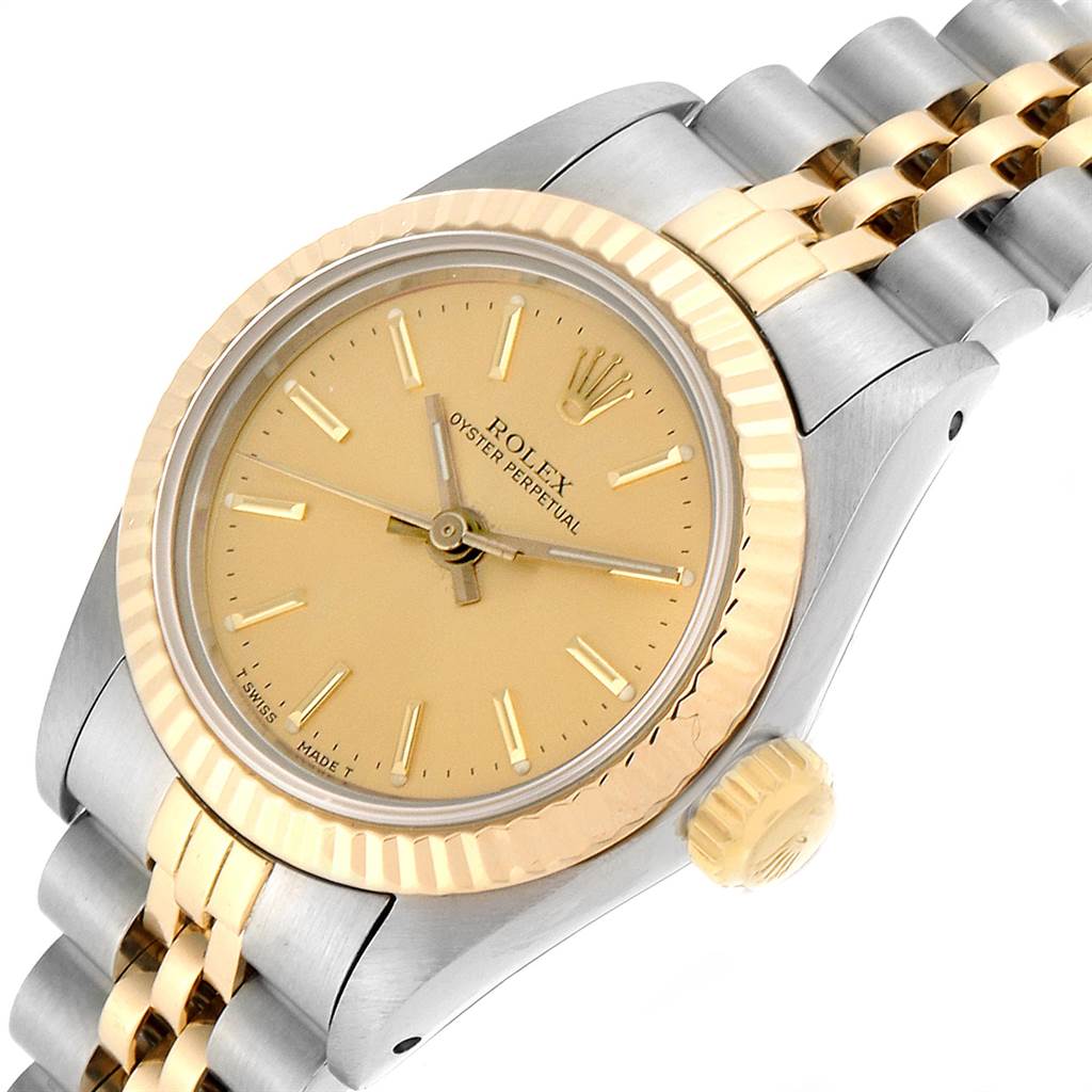 The image shows a side and slightly tilted top view of a Rolex Oyster Perpetual 67193 Women's Steel and Gold (two tone) Champagne Dial 67193 Women's Steel and Gold (two tone) Champagne Dial watch, highlighting the dial, bezel, crown, and bracelet.