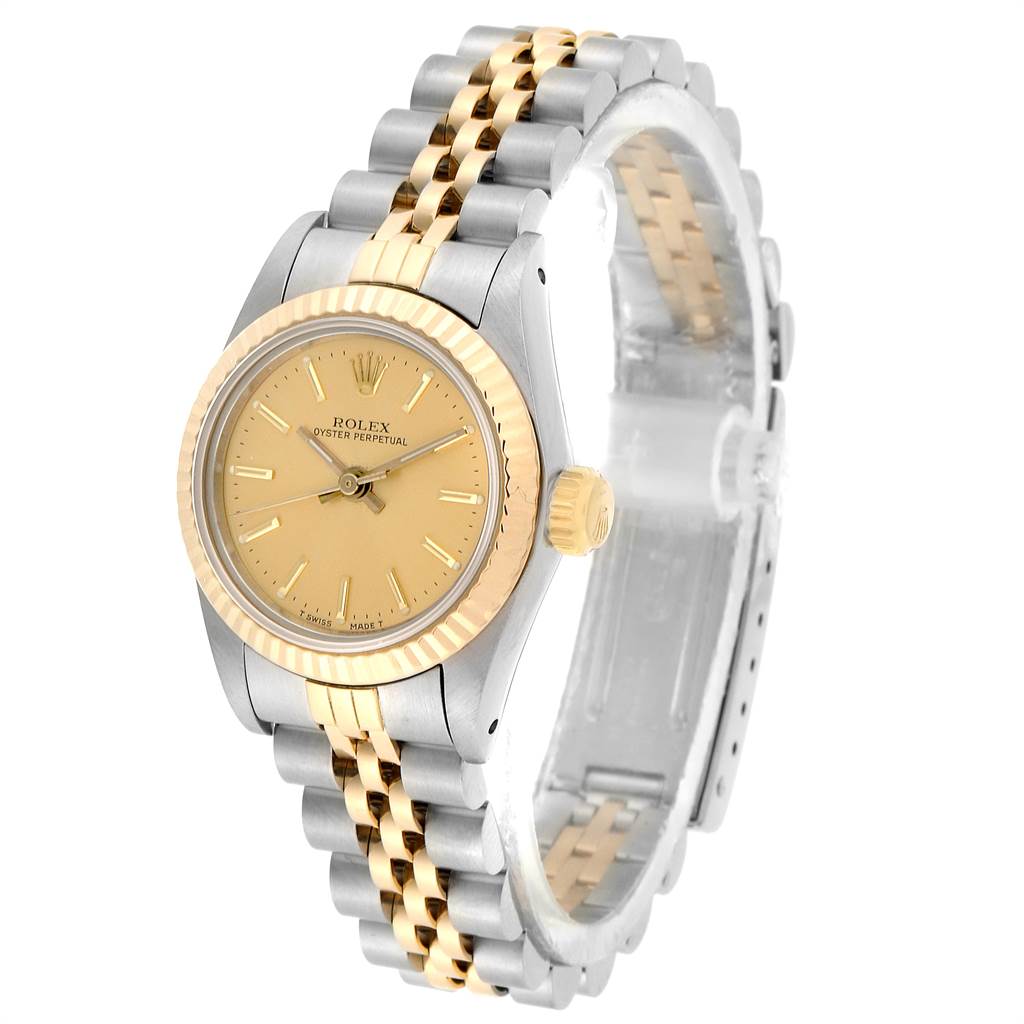 The Rolex Oyster Perpetual 67193 Women's Steel and Gold (two tone) Champagne Dial 67193 Women's Steel and Gold (two tone) Champagne Dial watch is shown at an angle displaying the face, crown, and bracelet.