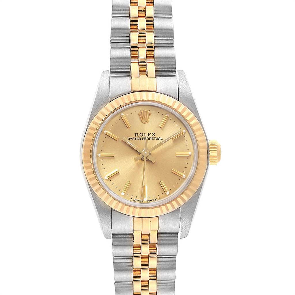 This image shows the Rolex Oyster Perpetual 67193 Women's Steel and Gold (two tone) Champagne Dial 67193 Women's Steel and Gold (two tone) Champagne Dial watch from a top-down angle, highlighting its face and two-tone bracelet.