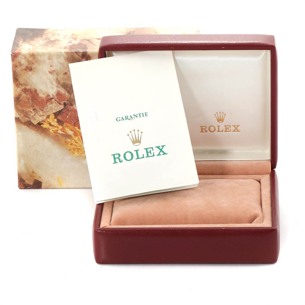 The image shows the opened box and warranty card of a Rolex Oyster Perpetual 67193 Women's Steel and Gold (two tone) Champagne Dial 67193 Women's Steel and Gold (two tone) Champagne Dial watch.