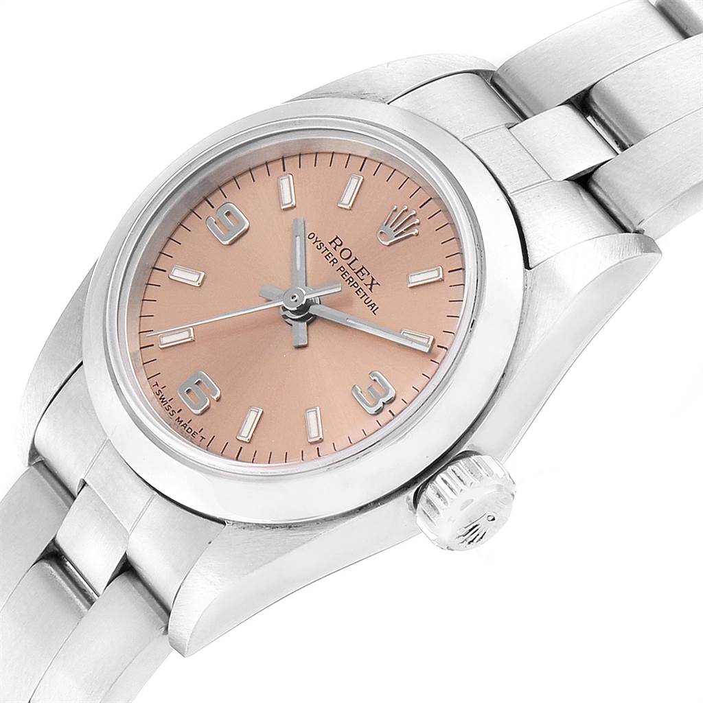 The image shows a close-up of a Rolex Oyster Perpetual 67180 Women's Stainless Steel Pink Dial 67180 Women's Stainless Steel Pink Dial watch, highlighting the dial, hands, case, and part of the bracelet.