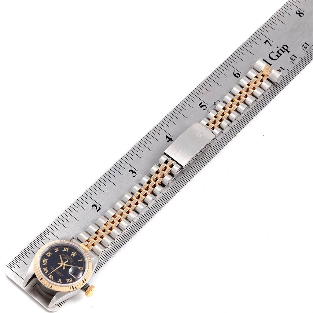 The image shows a Rolex Oyster Perpetual 69173 Women's Stainless Steel Black Dial 69173 Women's Stainless Steel Black Dial watch face and band, aligned next to a ruler for scale.