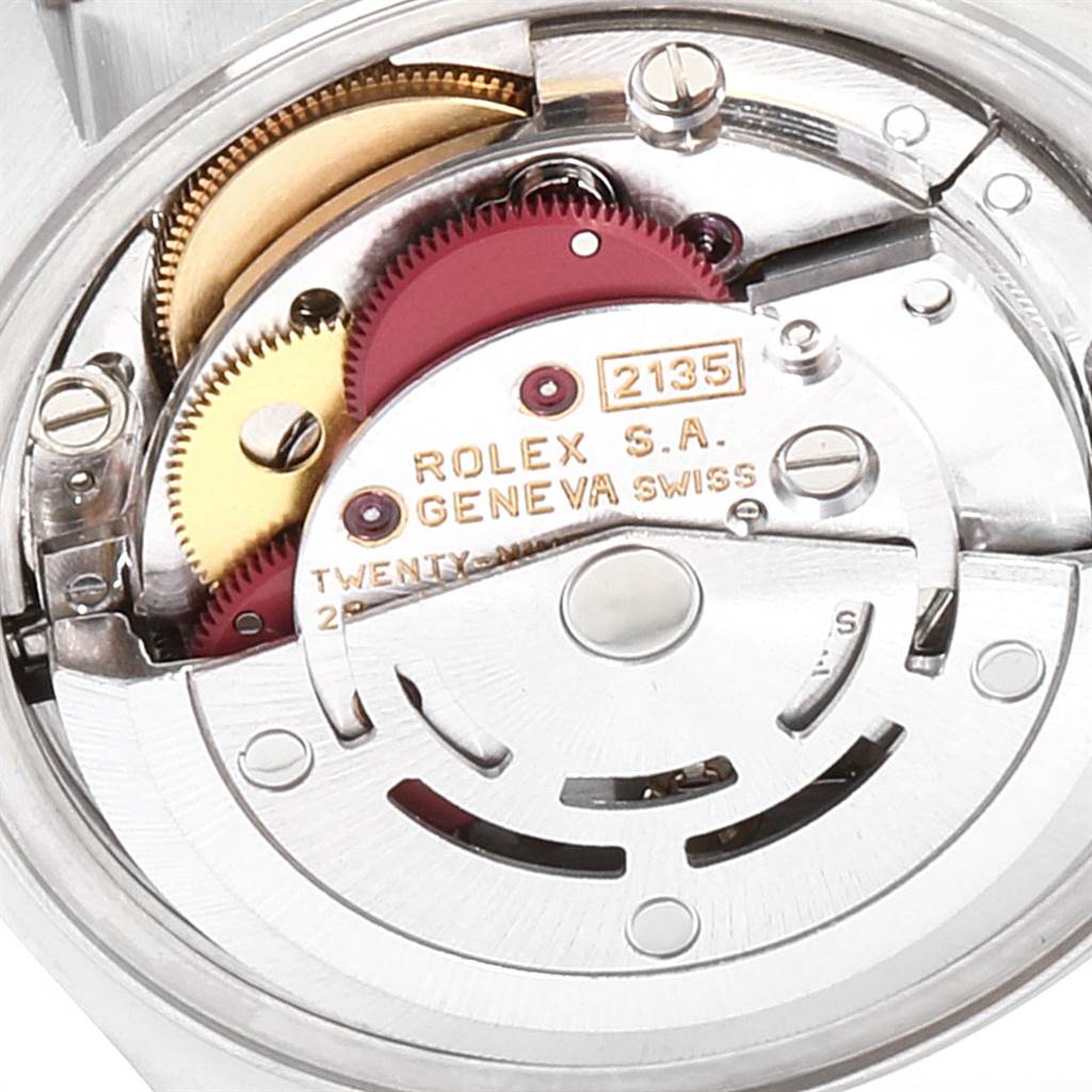 This image shows a close-up of the internal movement mechanism of the Rolex Oyster Perpetual 69173 Women's Stainless Steel Black Dial 69173 Women's Stainless Steel Black Dial model.