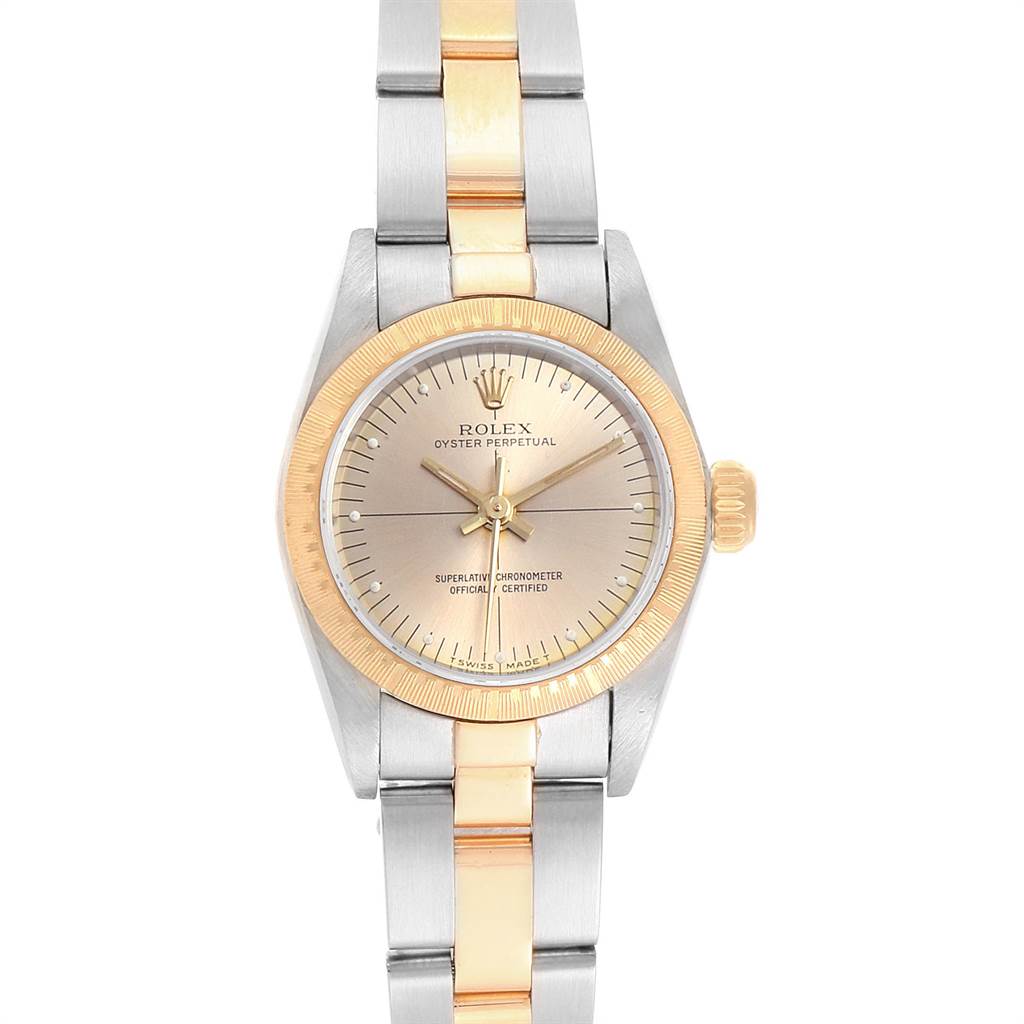 The Rolex Oyster Perpetual 67243 Women's Steel and Gold (two tone) Champagne Dial 67243 Women's Steel and Gold (two tone) Champagne Dial watch is shown from a top-down angle, fully displaying its face and two-tone metal bracelet.