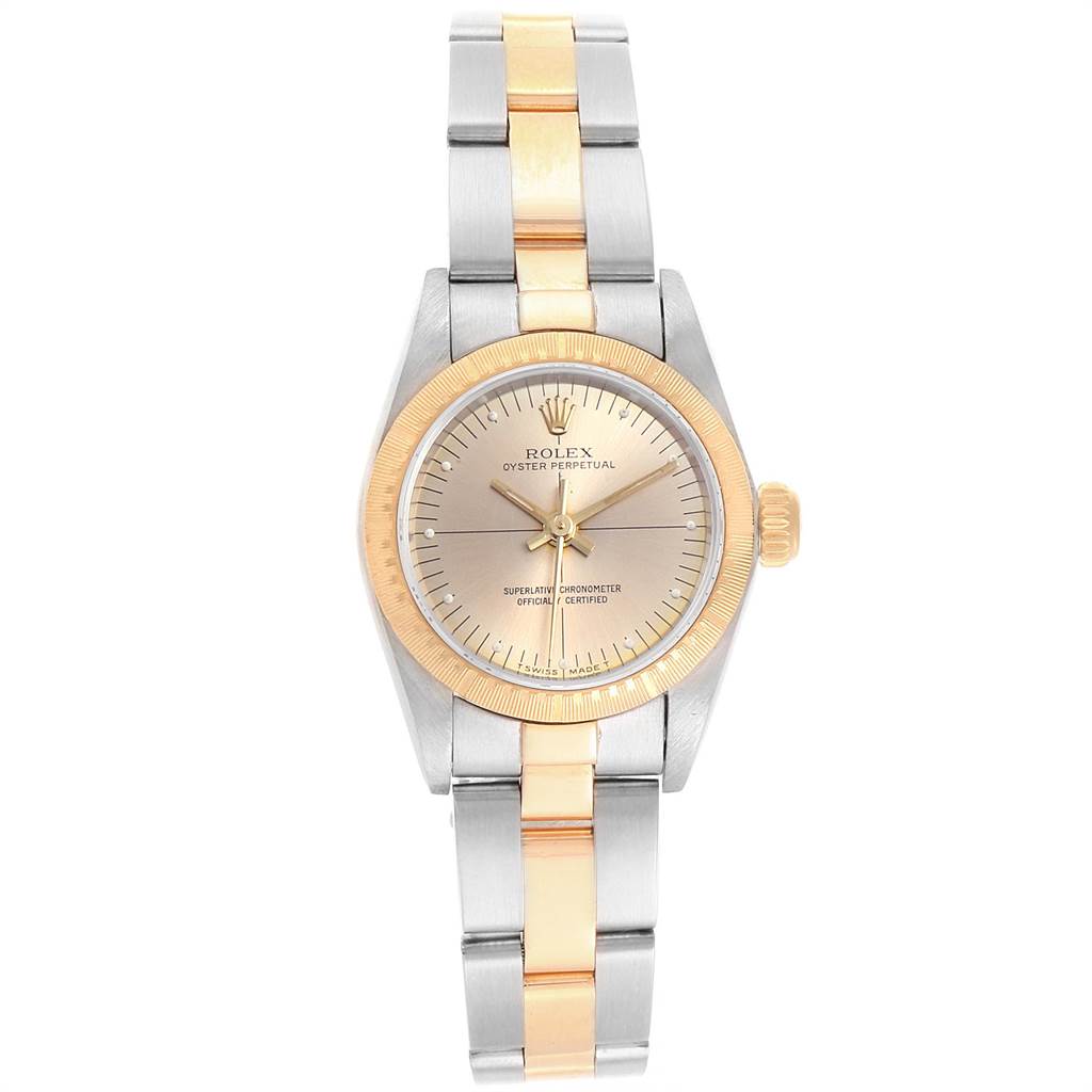 The image shows a Rolex Oyster Perpetual 67243 Women's Steel and Gold (two tone) Champagne Dial 67243 Women's Steel and Gold (two tone) Champagne Dial watch from a top-down angle, highlighting the face, bezel, and bracelet.